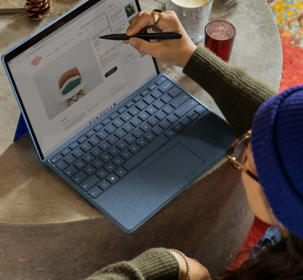 a women using a interactive laptop using a pen